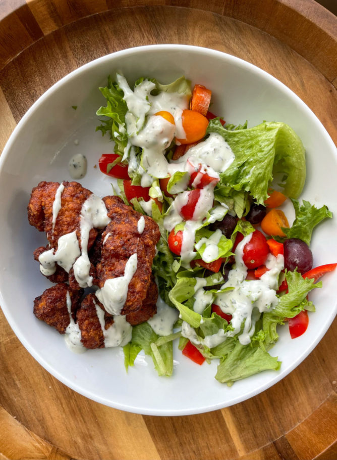 Mediterranean meatball bowls with salad greens, feta, and avocado dressing